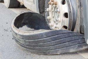closeup damaged 18 wheeler semi truck burst tires