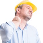 a construction worker massaging his neck