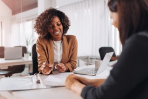 insurance agent and lawyer discussing a case