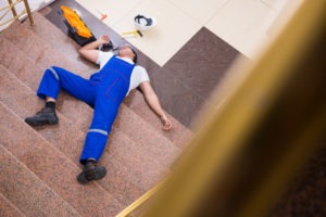 worker slipping and falling down the stairs