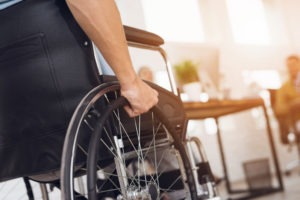 close-up of a man sitting in a wheelchair