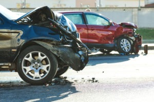 smashed-up cars in street